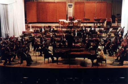Soloists Elini and Ioannis Hallecker performing Mozart's double concerto for pianos with the Athens State Orchestra. Viron Fidetzis, conductor, 2001.